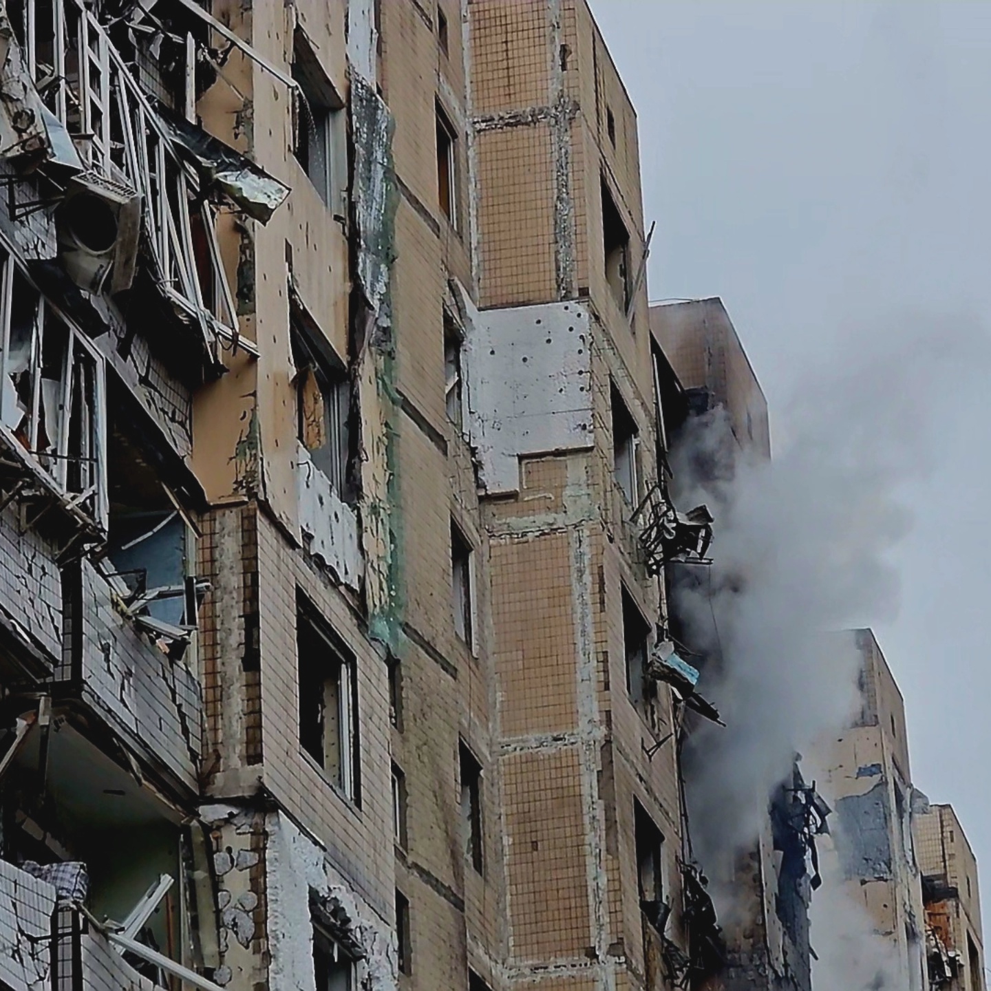 Smoke rises from a building hit by debris of a missile launched against Kyiv by Russia in Solomians'kiy district, Kyiv.