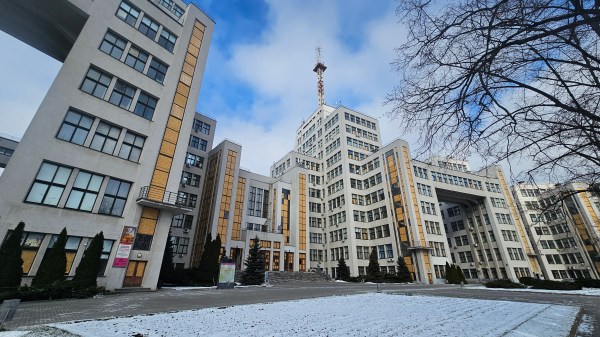 Derzhprom building in Kharkiv, wooden pannels on many windows, seen from Svoboda square on a wintry but sunny day